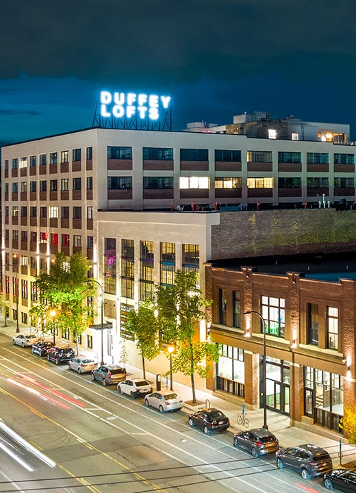 Duffy Lofts apartment building with neon signage